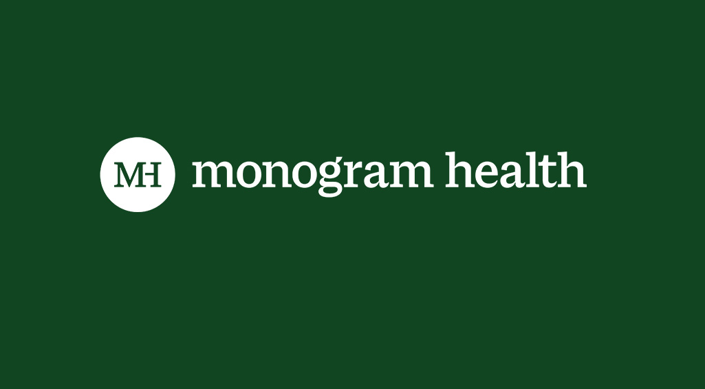 Solid dark green background with a white Monogram Health logo