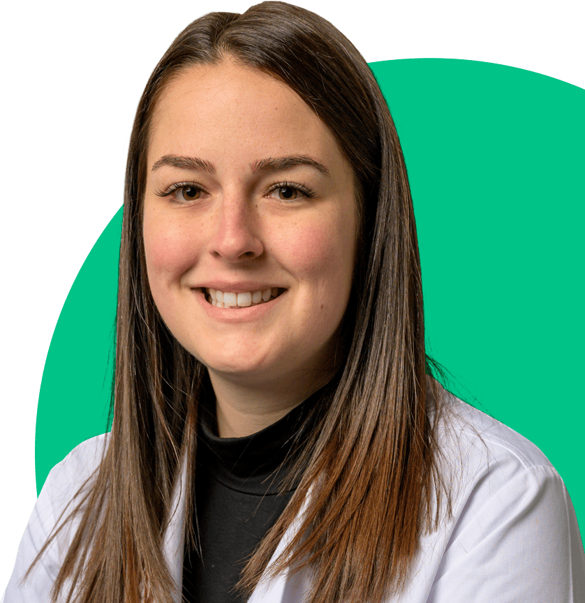 Nurse smiling with a green circle background.