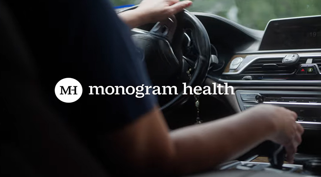 Monogram Health APP driving a car